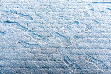 Lots of footprints in freshly fallen snow 