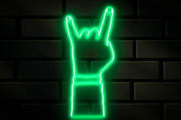 Goat neon sign on a dark brick wall.