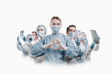 medical workers heroes. a nurse in the foreground in a mask and uniform holds her hands in the shape of a heart. go to a lot of medical professionals. - 427921611