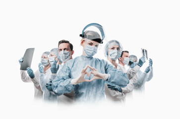 medical workers heroes. a nurse in the foreground in a mask and uniform holds her hands in the...