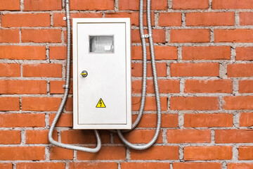 Protection of an electricity meter against the background of a brick wall of a heating unit at an...