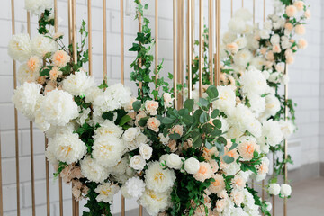 close-up of artificial flowers of white and pink color in the room.