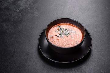 Tasty fresh spicy Malaysia soup tom yam with tomato