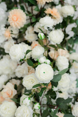 close-up of artificial flowers of white and pink color in the room.