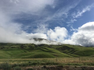 Clouds over the green hills outside Grapevine, California, USA