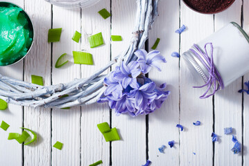 cosmetic cream product samples with hyacinth flowers on white wooden background