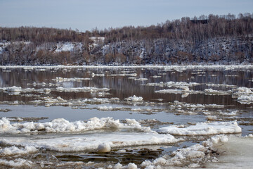 Breaking up the ice on the river. Ice drift on the river.