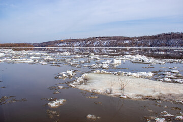 Breaking up the ice on the river. Ice drift on the river.