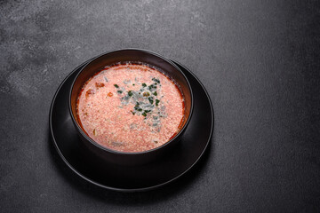 Tasty fresh spicy Malaysia soup tom yam with tomato