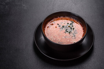 Tasty fresh spicy Malaysia soup tom yam with tomato