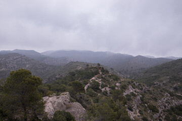 Landscape of mountains with mist and raining in autumn, captured from the top of the mountain