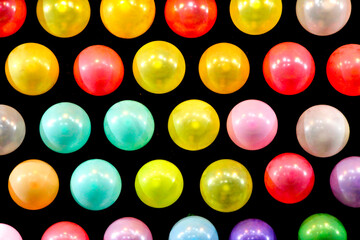 Panel with colored balloons in a row in a fair