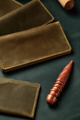 Handmade products made of genuine yellow and red leather. Leather passport cover, leather wallet. Leather goods for men. The view from the top