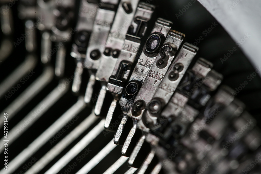Fototapete close up of the letters on retro style typewriter.