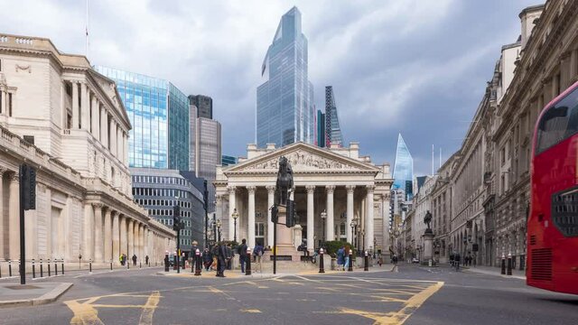 Time lapse view of the busy square in front of the Bank in England with the new skyscrapers in the background
