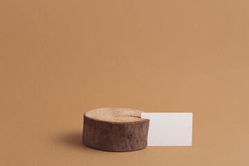 Wooden stump podium and blank paper card mock up
