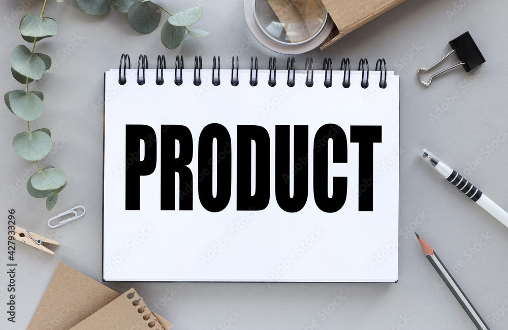 Poster notebook with the text product. magnifying glass and plant near notepad