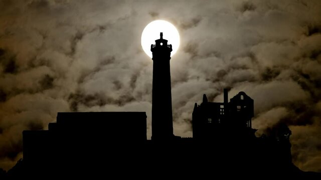 Alcatraz Prison By Night with Dark Atmosphere, Fog, Smoke, and Full Moon, San Fransico, USA