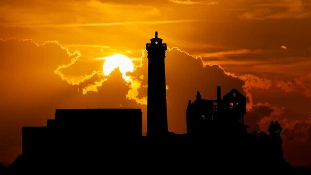 Alcatraz Island prison in San Fransico, Time Lapse at Sunset with Red Sun and Fiery Sky, USA