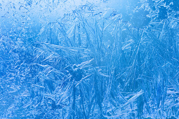 Abstract ice flowers pattern, frosted window macro view background. cold winter weather xmas...