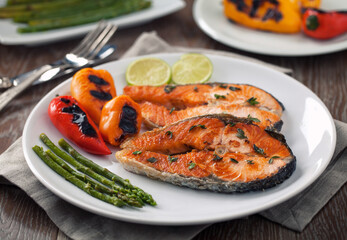 Fillet of salmon with mixed vegetables on a plate.