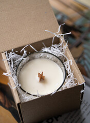 Natural new soy wax candle with wooden wick in clear glass jar