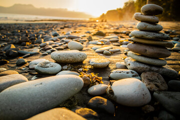 Fototapeta na wymiar Stack of Stones on the Beach