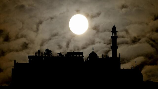 Mumbai: Haji Ali Dargah Mosque in Silhouette by Night with Moon, Fog, Smoke and Dark Atmosphere