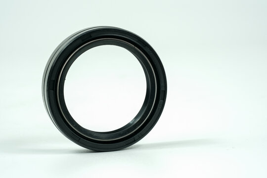 Spare part rubber seal for motorcycle fork.on a isolated white background. Motorcycle service.	