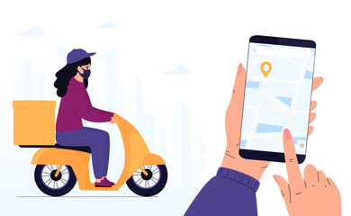 COVID-19. Quarantine. Coronavirus epidemic. Delivery woman in a protective mask delivers parcel by motorbike. Track shipments using the mobile application. Hand is holding smartphone