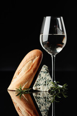 Blue cheese with bread, rosemary and wine.