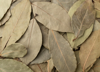 Top view, closeup of dried bay leaves. Food backdrop