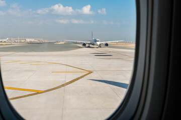 Looking through window aircraft on runway during taking off