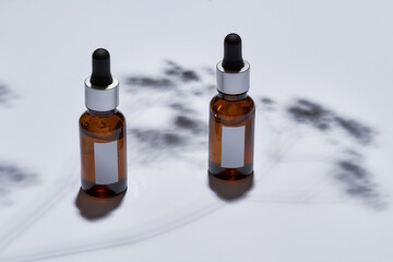 Glass bottles for cosmetological oil with empty labels
