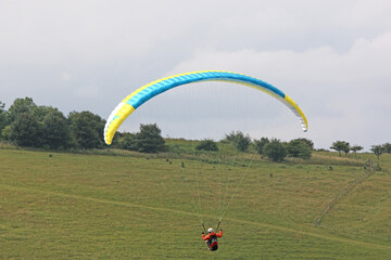 Paraglider flying at Milk Hill, Wiltshire	
