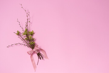 Bouquet from twigs with buds and early leaves. Copy space.
