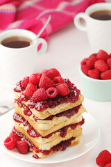 Sandwiches with peanut butter and raspberry jam