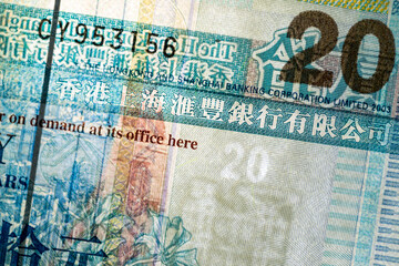 Horizontal closeup detail of obverse side of twenty 20 Hong Kong dollars HKD banknote with translucent watermark and security features, 2003 series