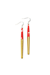 Vertical closeup of stylish upcycled red golden pendant hook earrings made out of paper waste, isolated on a white background. Creative reuse of post-consumer waste, ideal gift for her.