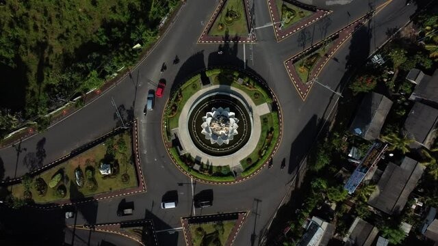 Dense traffic roundabout top down static aerial in Bali Indonesia. High quality 4k footage
