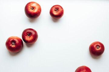 Ripe juicy red rayal gala apples on grey backgroung. Top view. Flat lay.