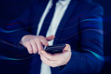 Businessman in a shirt and a blue jacket with digital wave and martphone in hand.