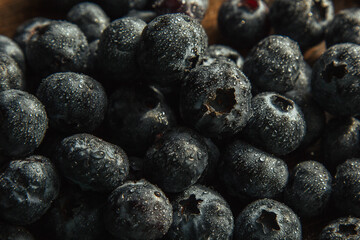 Blueberries with water drops. Beautiful macro photo of a berry. desktop wallpaper. Health and freshness concept.