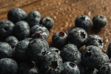 Blueberries with water drops. Beautiful macro photo of a berry. desktop wallpaper. Health and freshness concept.