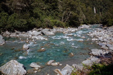 Rocky terrain and a waterfall at Thunder Creek in New Zealand