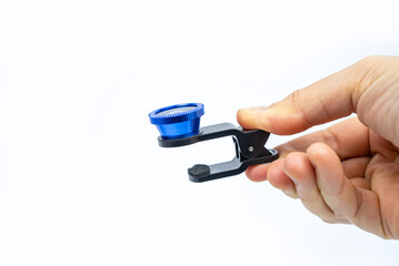 Phone photo lens with clips on white background. Extra macro camera for smartphone. Set of lenses wide angle, fish eye and macro