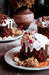 Easter cakes. Panettone. Traditional Easter cake with orange, candied fruit, raisins and cinnamon on a rustic background. Close-up