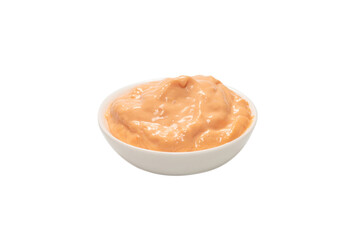 Sauce in a bowl isolated on white.
