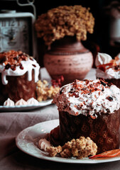 Easter cakes. Panettone. Traditional Easter cake with orange, candied fruit, raisins and cinnamon on a rustic background. Close-up
