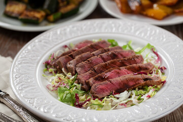 Fillet of beef with mixed salad. High quality photo.